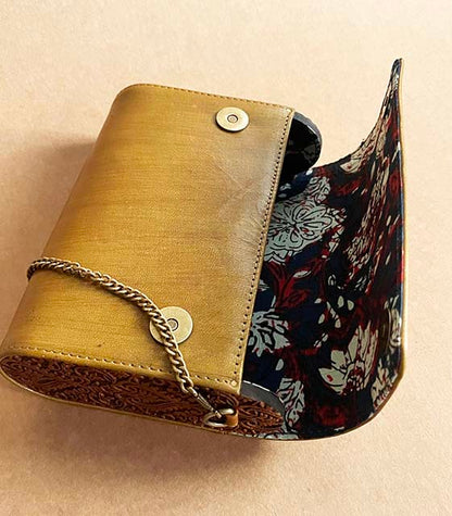 Handfinished carved wood and leather sling bag